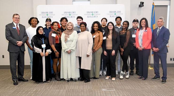 Group photo of Delaware tech administration and students.